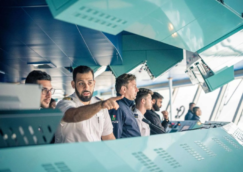 Maritime professionals working together on a ship's bridge